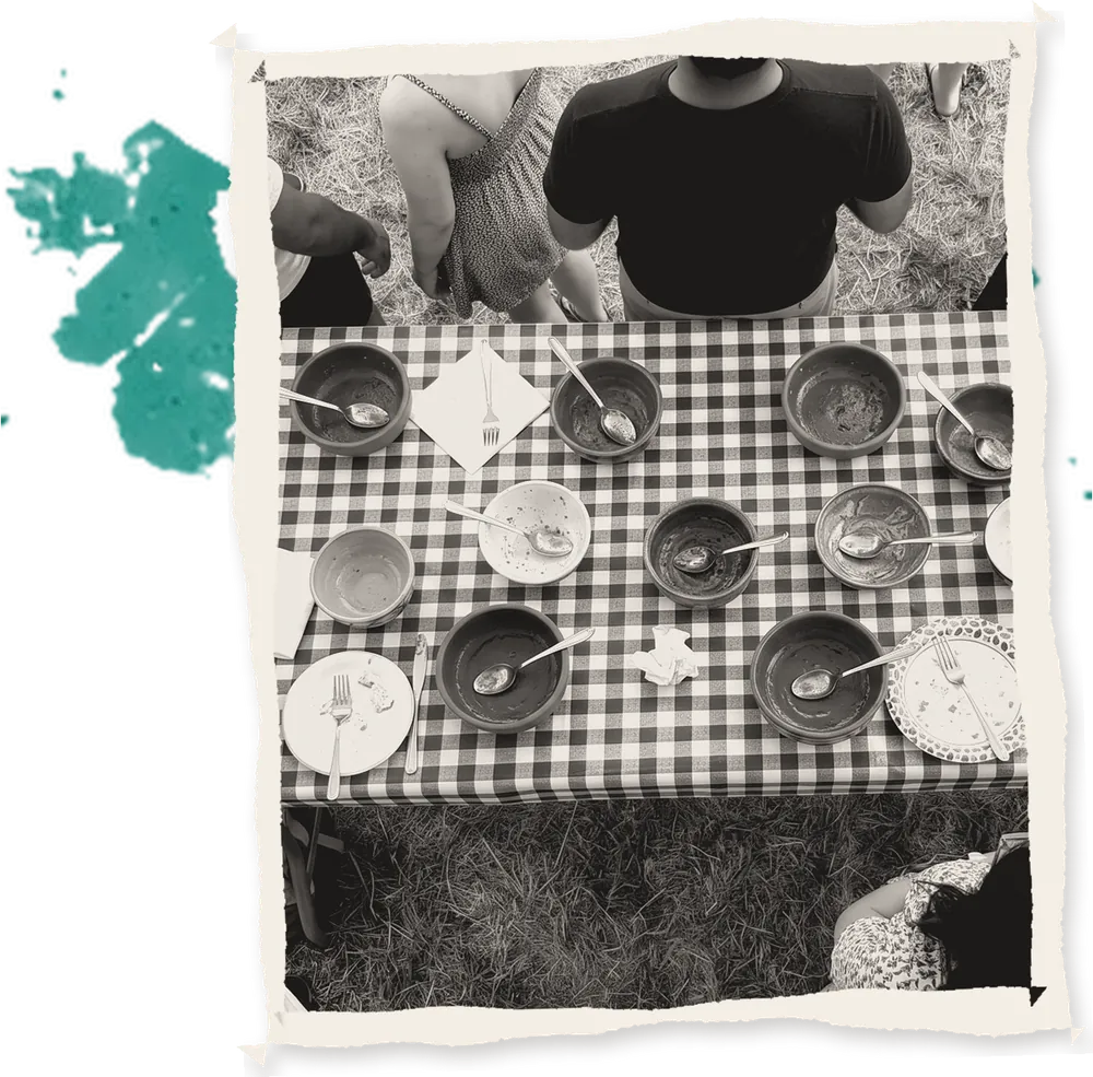 Terracotta bowls on a checked tablecloth, seen from above