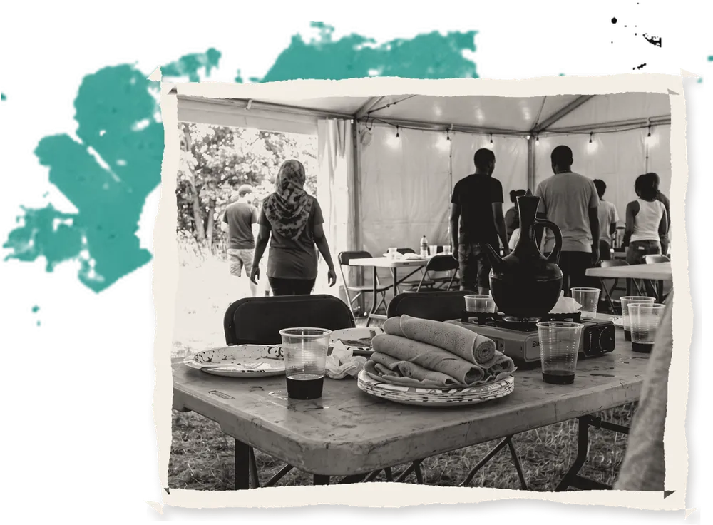 Injera and a clay coffee pot on a pavilion table