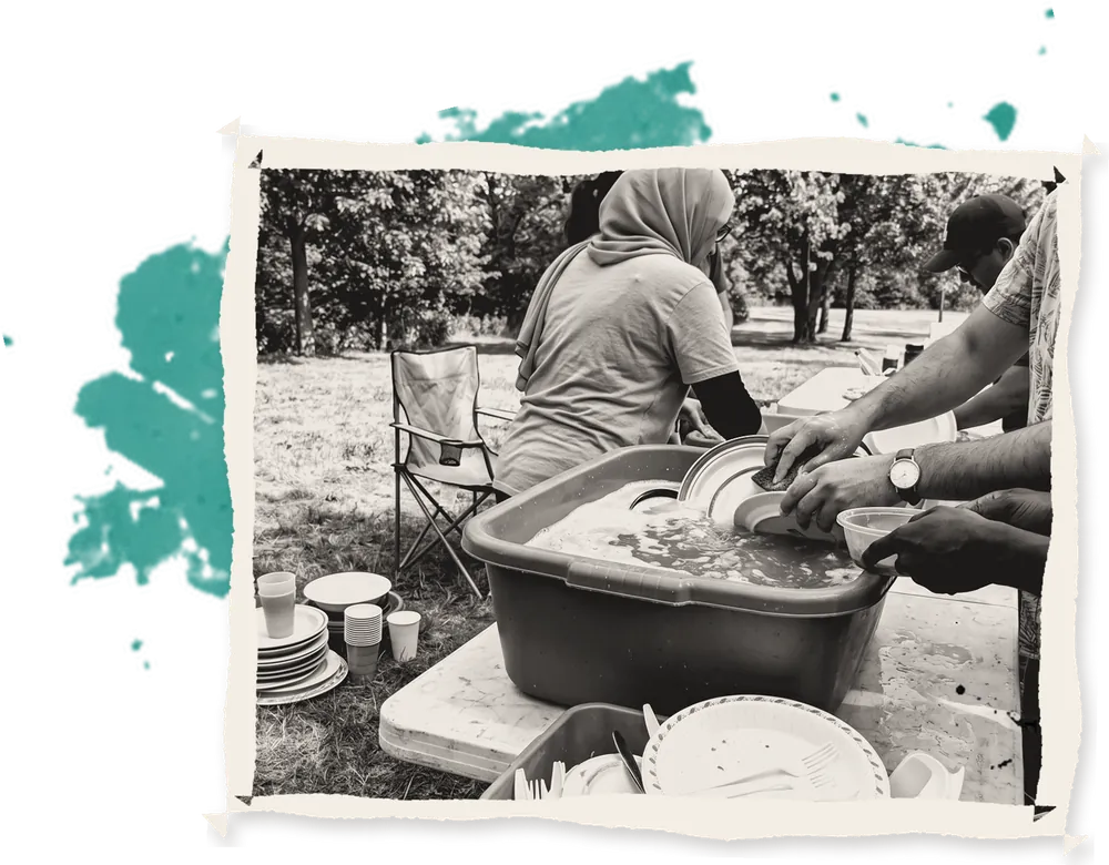 Volunteers washing dishes in basins